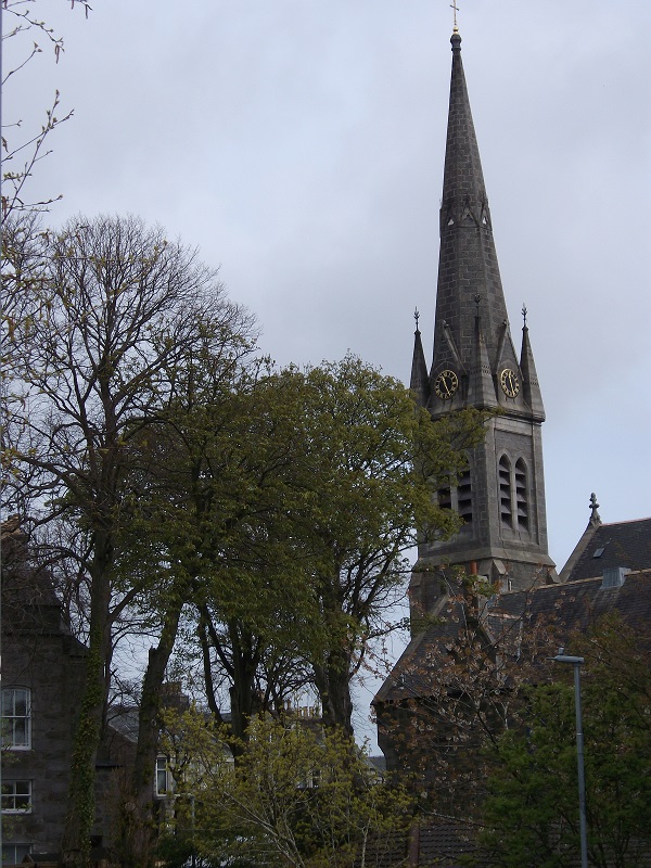 Ferryhill Parish Church clock tower, seen through trees