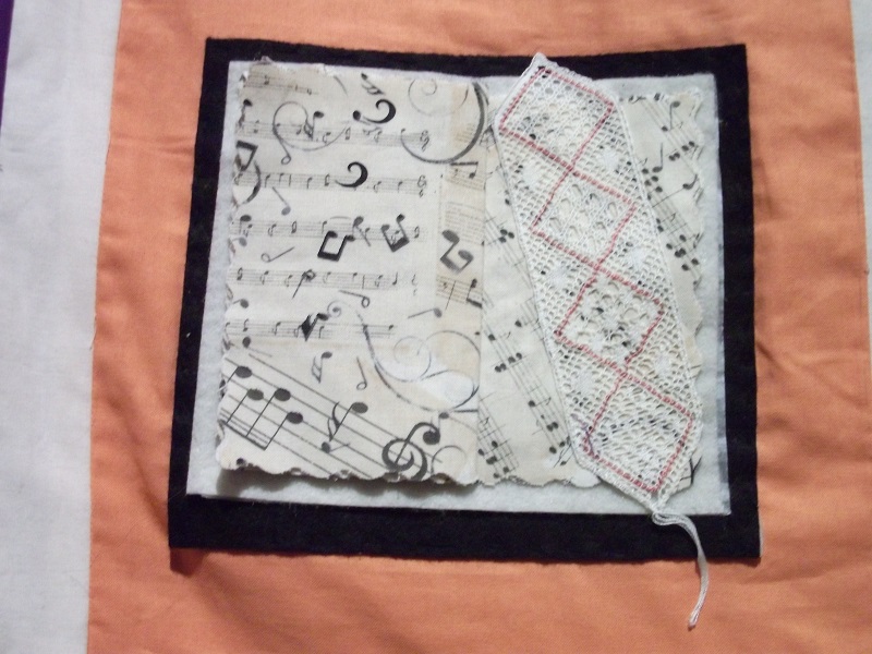 A piece of a blanket with musical notes