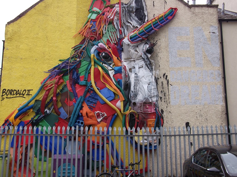 street art of large and multicoloured unicorn