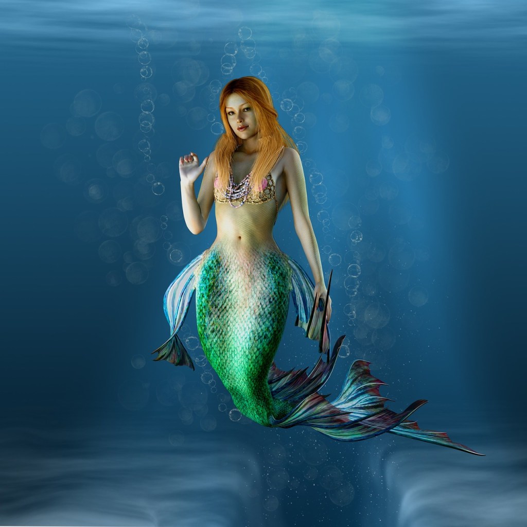 mermaid with auburn hair and green tail