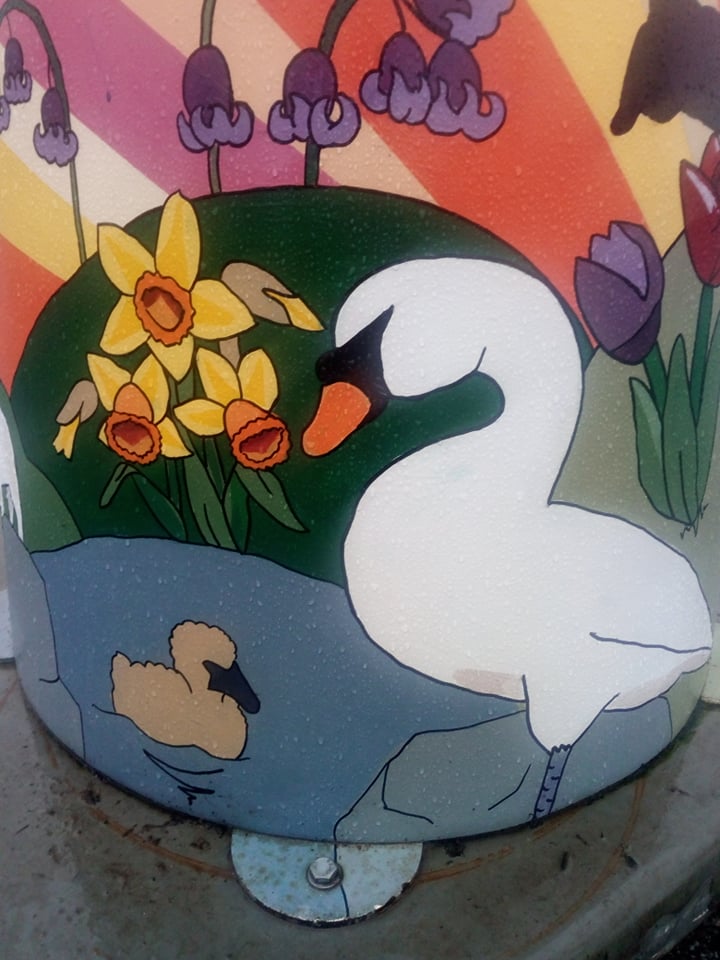 picture of swan on painted lighthouse sculpture