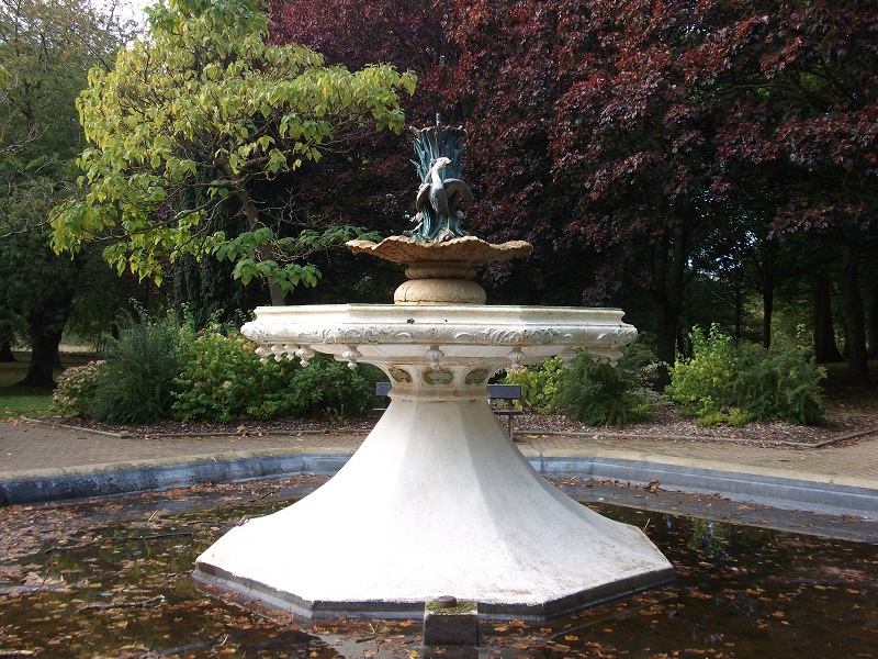 fountain, white base and bird sculpture on top