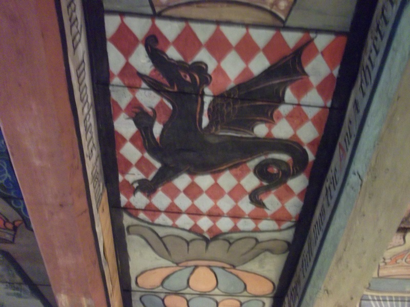 A painted ceiling with a dragon
