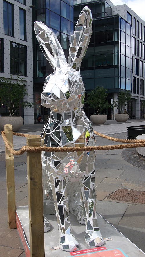 a hare sculpture covered in pieces of mirrored glass