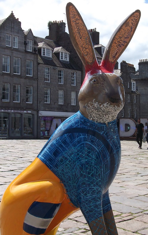 A hare sculpture in a sailor costume
