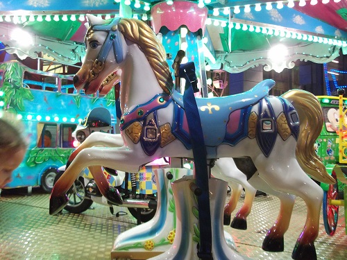 Horses in a merry go round