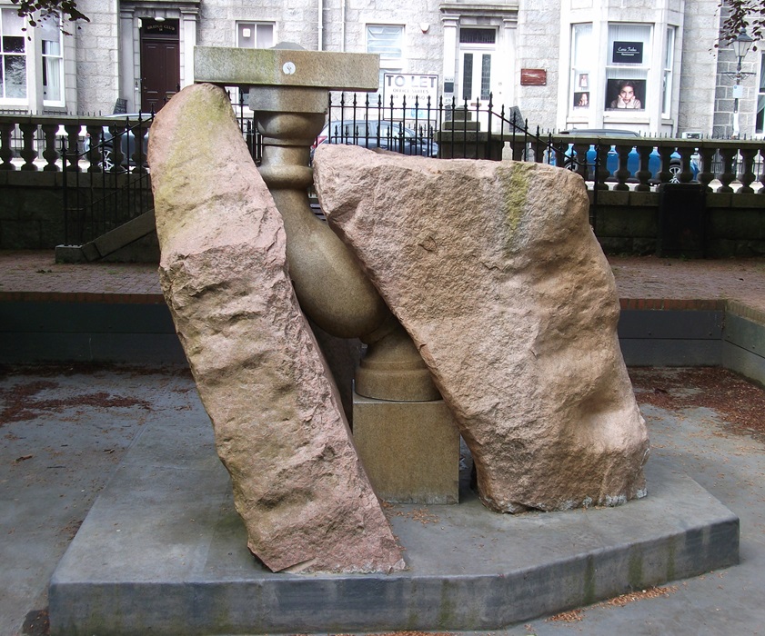 A fountain with granite sculpture