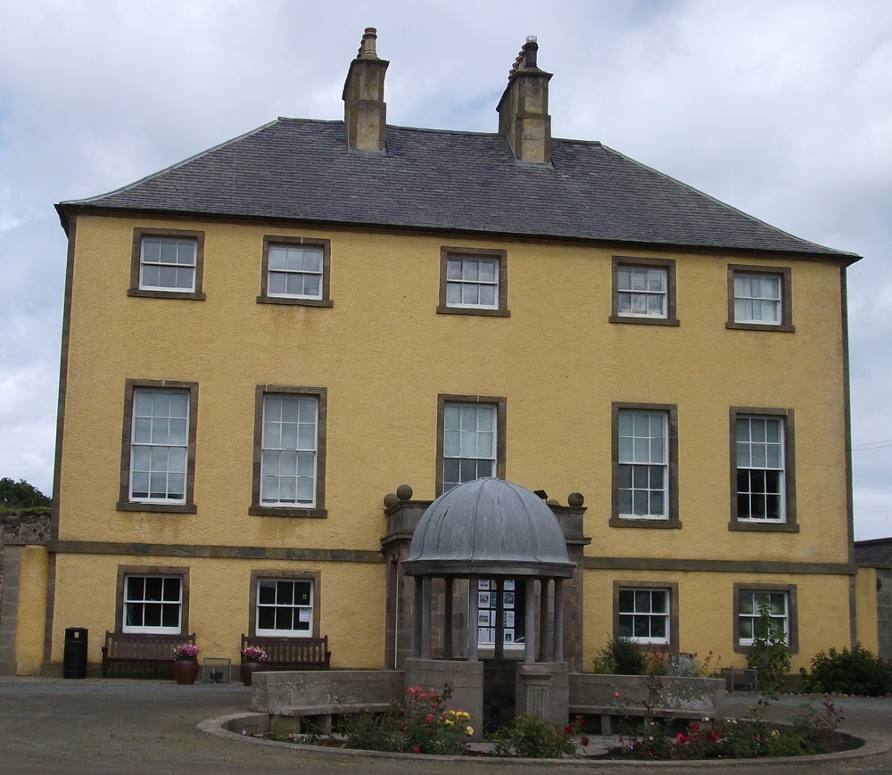 a yellow stately house