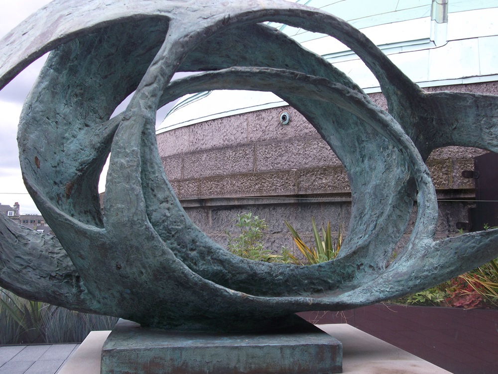 a large bronze sculpture of interlinked circles