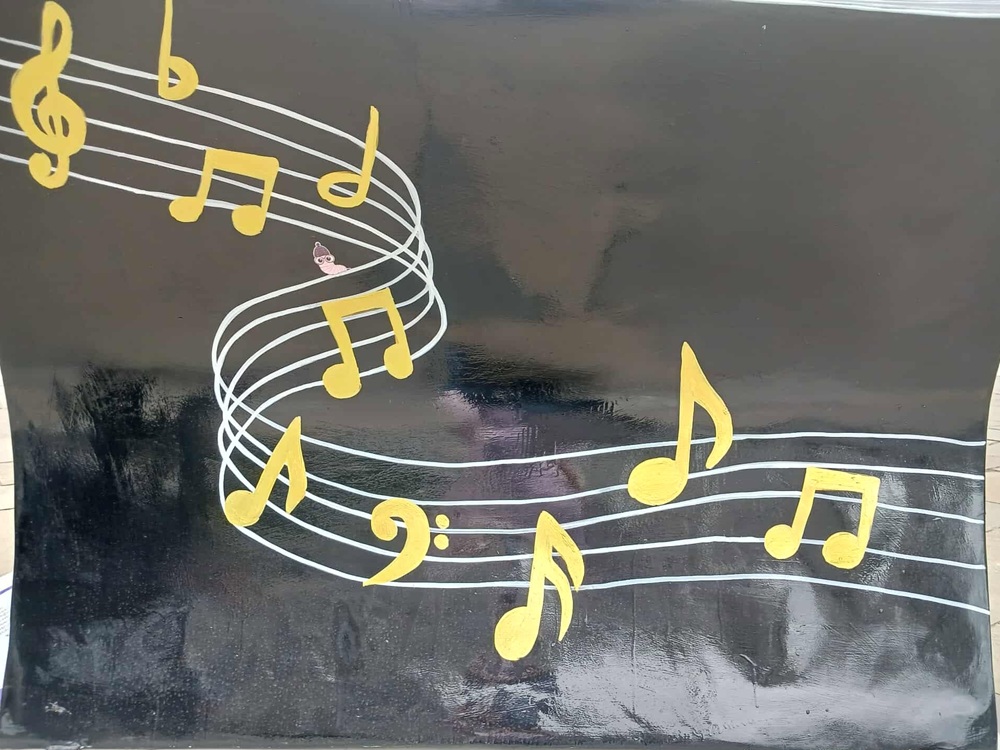 gold musical notes against a black background