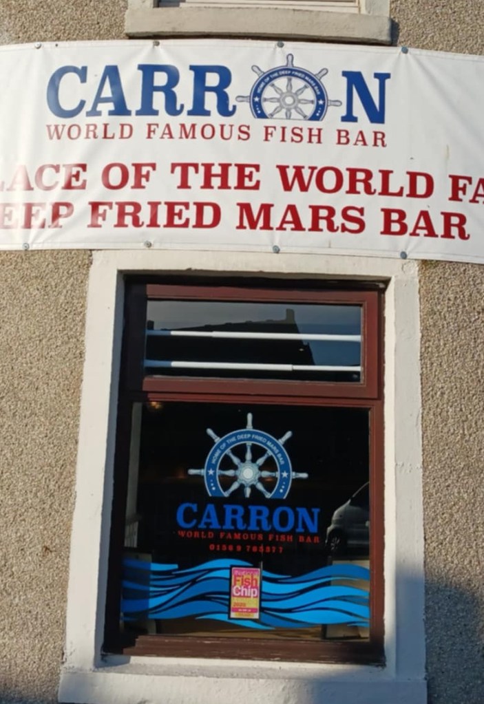 A window with sign above: Carron World Famous Fish Bar