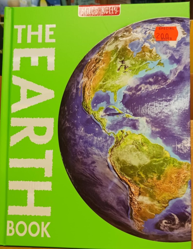A green book with words The Earth Book and a picture of the planet from space with blue seas and green land
